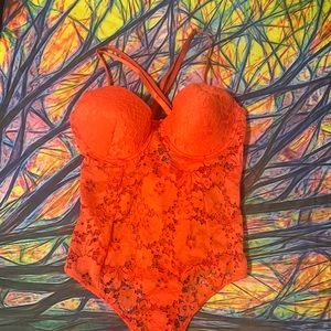 Orange lacey body suit
